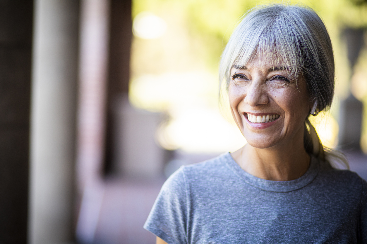 smiling mature women with tight, tone skin