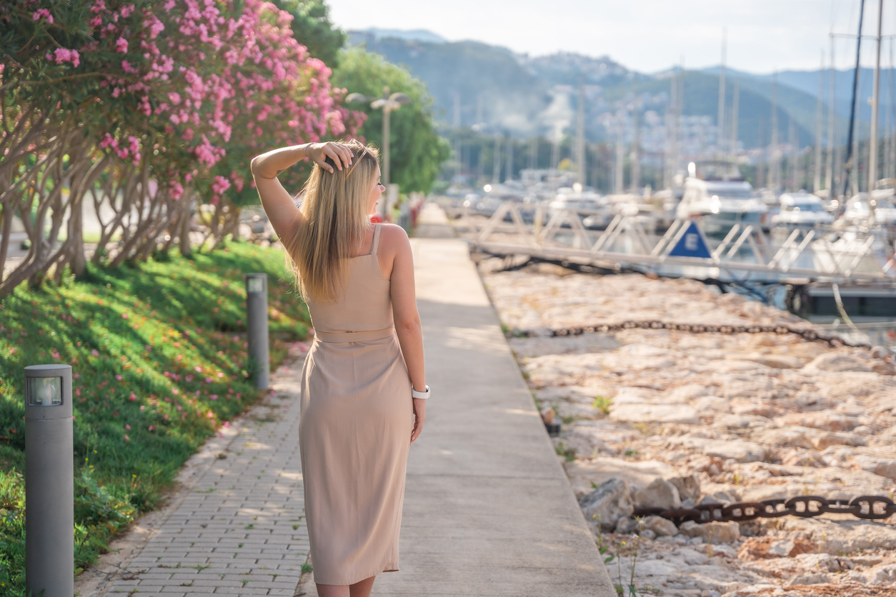 woman walking by marina