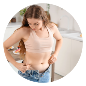 woman-considering-fat-grafting-inspecting-stomach
