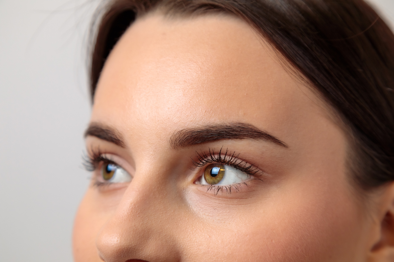 Woman showing perfect eyebrows after eyebrow lift